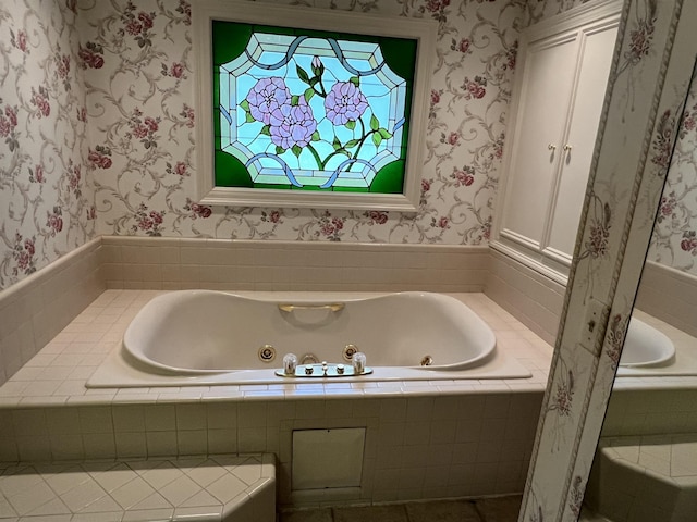 bathroom with a relaxing tiled tub