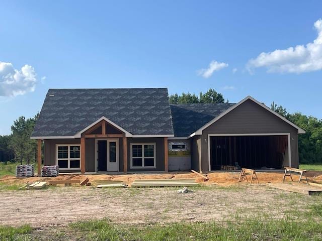 255 Ralph Nerren Rd, Huntington, TX 75949 - view of front facade with a garage