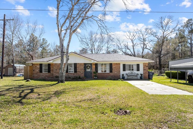 single story home featuring driveway, brick siding, fence, and a front yard