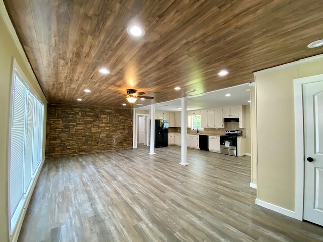 122 Otteson Ln, Lufkin, TX 75901 - unfurnished living room featuring wooden ceiling, ceiling fan, wood finished floors, decorative columns, and recessed lighting