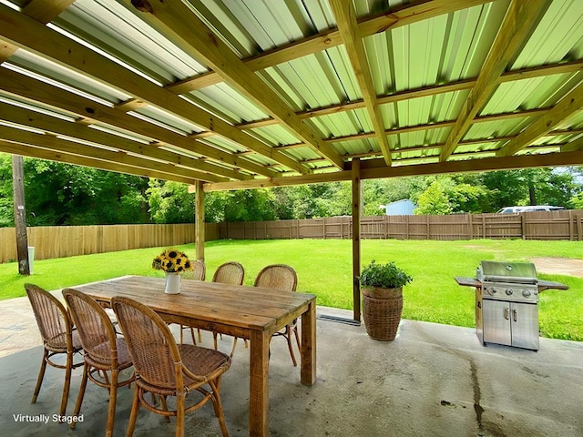 122 Otteson Ln, Lufkin, TX 75901 - fenced backyard featuring area for grilling, a patio, and outdoor dining area