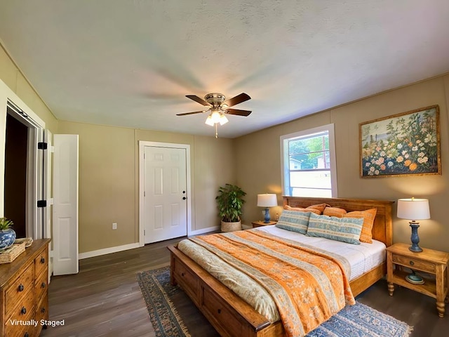 bedroom featuring ceiling fan and dark hardwood / wood-style floors