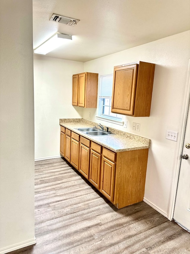 kitchen featuring light hardwood / wood-style floors and sink