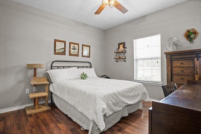 bedroom with wood finished floors, baseboards, and ceiling fan