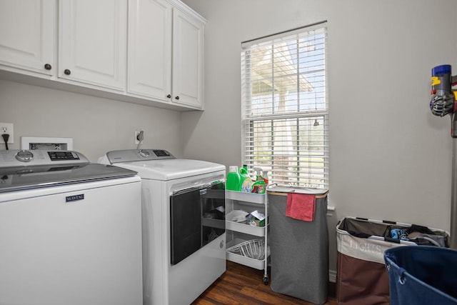 laundry room with cabinet space, dark wood-style floors, and washing machine and dryer