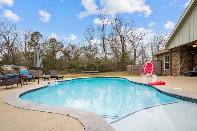 view of pool featuring a fenced in pool, a fenced backyard, and a patio area