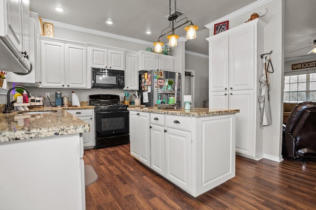 kitchen featuring a sink, black appliances, ornamental molding, and white cabinets