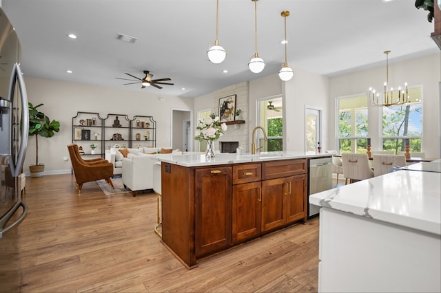217 Derek Rd, Lufkin, TX 75904 - kitchen with a sink, appliances with stainless steel finishes, a chandelier, light wood finished floors, and recessed lighting