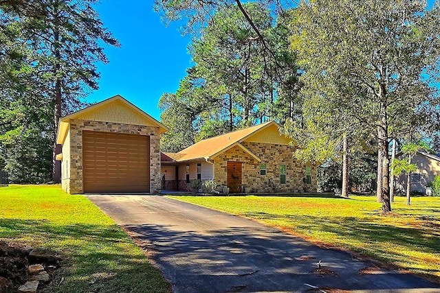 view of front of house featuring a front yard and a garage