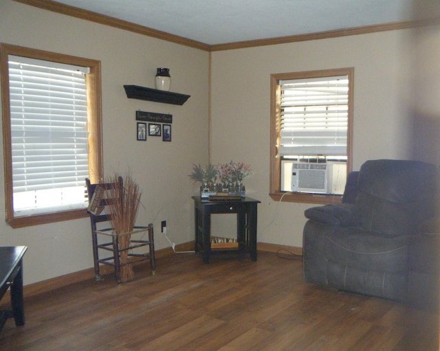 living area with dark hardwood / wood-style flooring, cooling unit, and ornamental molding