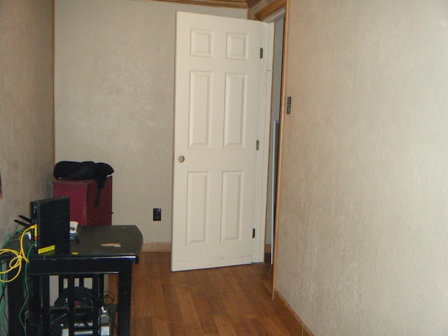 hallway featuring dark wood-type flooring