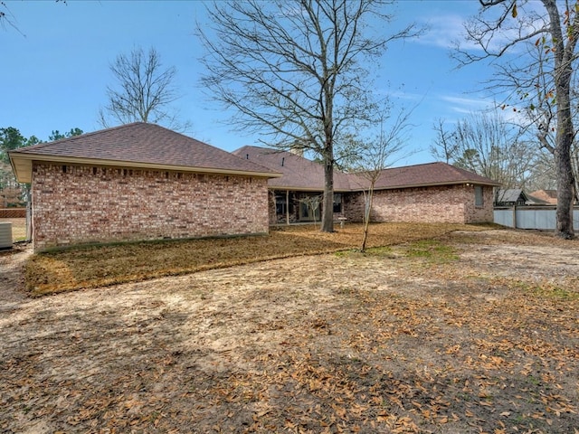 back of property with central AC unit