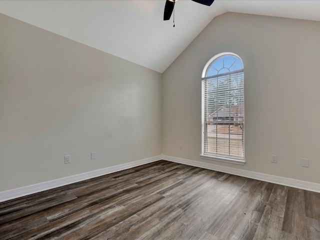 empty room featuring hardwood / wood-style flooring, ceiling fan, and vaulted ceiling