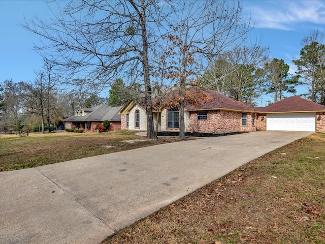 ranch-style house featuring a garage and a front lawn