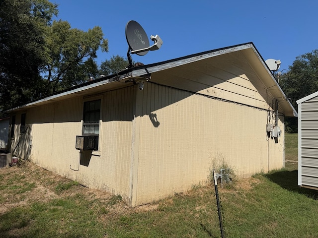 view of property exterior featuring a yard and cooling unit