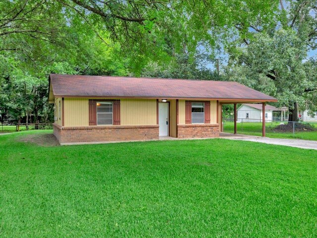 156 Spain Rd, Lufkin, TX 75901 - single story home featuring brick siding, an attached carport, concrete driveway, and roof with shingles