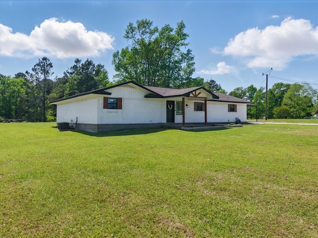 single story home featuring central air condition unit, a porch, and a front yard