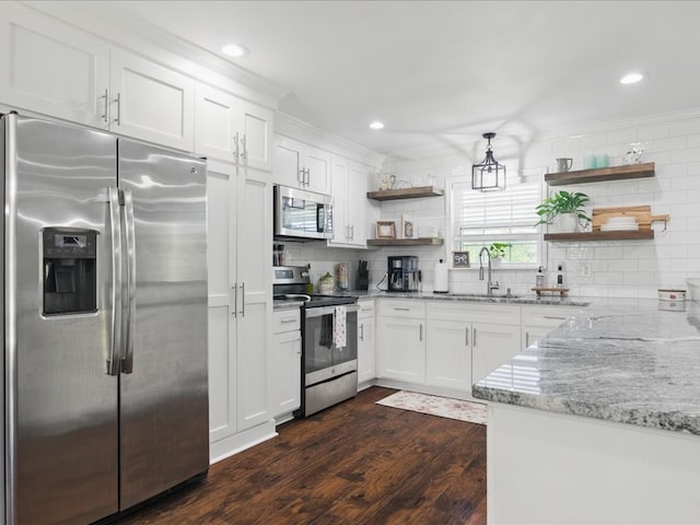 kitchen with open shelves, tasteful backsplash, appliances with stainless steel finishes, and a sink