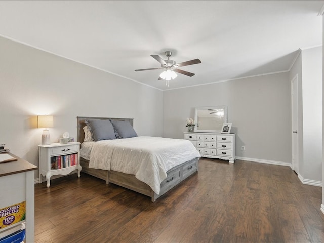 bedroom featuring baseboards, crown molding, dark wood-style floors, and a ceiling fan