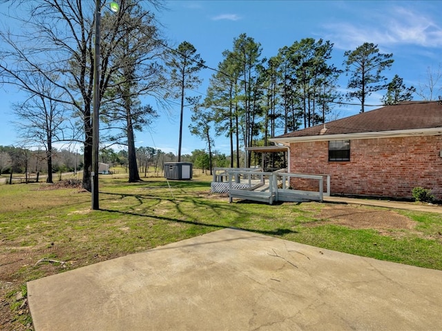 view of yard with a patio and a deck