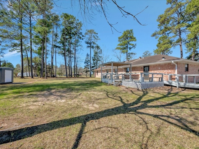 view of yard featuring a deck