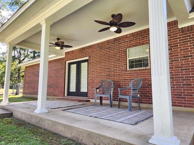 view of patio / terrace featuring ceiling fan and french doors