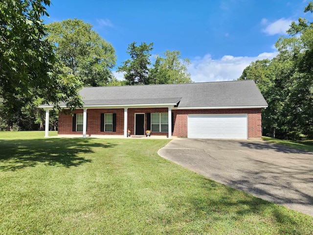 ranch-style house featuring a garage and a front lawn