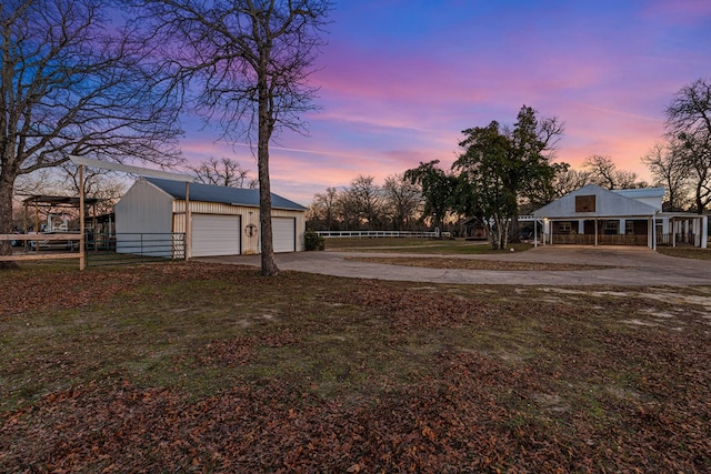 view of yard at dusk