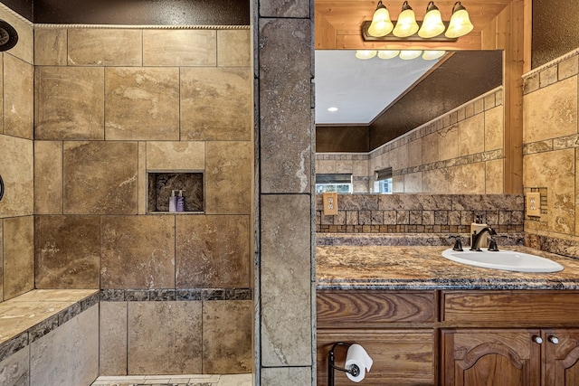 bathroom with tasteful backsplash and vanity