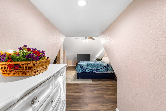 bedroom with dark hardwood / wood-style flooring