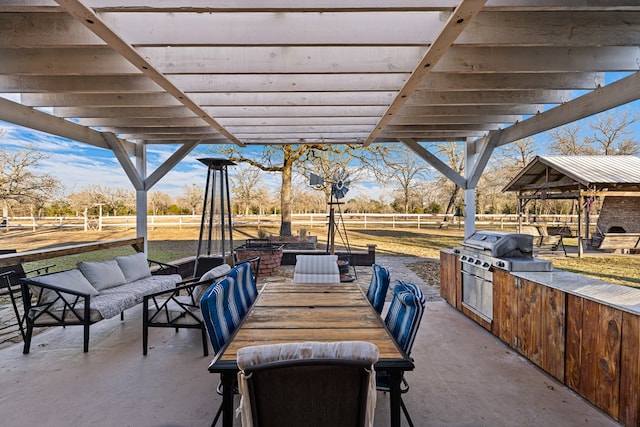 view of patio featuring area for grilling, a pergola, outdoor lounge area, and an outdoor kitchen