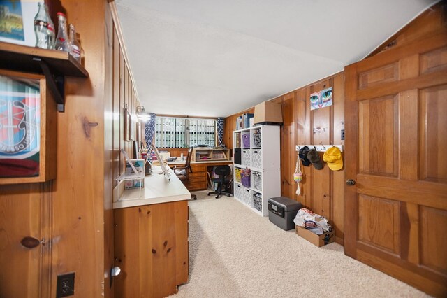 1514 Spanish Moss Dr, Lufkin, TX 75904 - home office featuring light colored carpet, wooden walls, and lofted ceiling