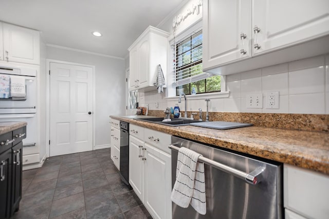 1514 Spanish Moss Dr, Lufkin, TX 75904 - kitchen featuring dishwasher, white double oven, ornamental molding, a sink, and white cabinetry
