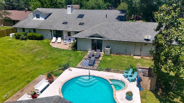 1514 Spanish Moss Dr, Lufkin, TX 75904 - rear view of property with roof with shingles, a patio, a pool with connected hot tub, and a chimney