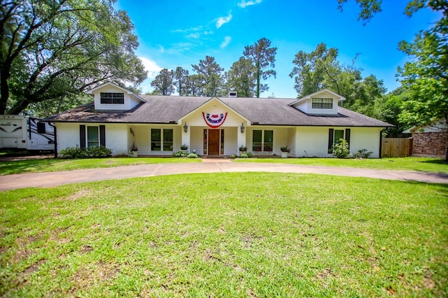 1514 Spanish Moss Dr, Lufkin, TX 75904 - view of front of home featuring curved driveway, covered porch, brick siding, and a shingled roof