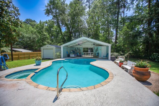 1514 Spanish Moss Dr, Lufkin, TX 75904 - view of swimming pool with an outdoor structure, a patio, fence, ceiling fan, and a pool with connected hot tub