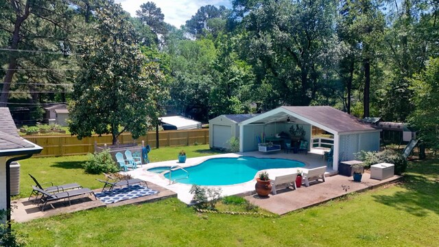 1514 Spanish Moss Dr, Lufkin, TX 75904 - view of pool featuring an outbuilding and a patio area