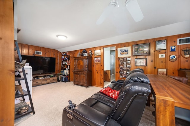 1514 Spanish Moss Dr, Lufkin, TX 75904 - carpeted living area with wood walls and vaulted ceiling