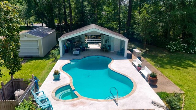 1514 Spanish Moss Dr, Lufkin, TX 75904 - view of swimming pool featuring a patio, an outdoor structure, a gazebo, a shed, and a pool with connected hot tub