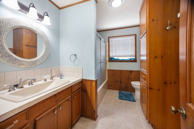 1514 Spanish Moss Dr, Lufkin, TX 75904 - bathroom with ornamental molding, wainscoting, toilet, shower / bath combination with glass door, and vanity