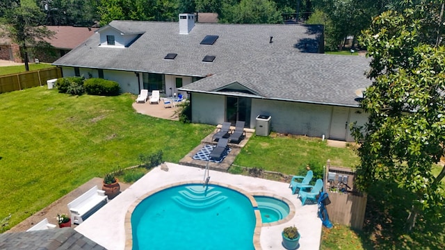 1514 Spanish Moss Dr, Lufkin, TX 75904 - rear view of house featuring roof with shingles, a patio area, a pool with connected hot tub, and a chimney