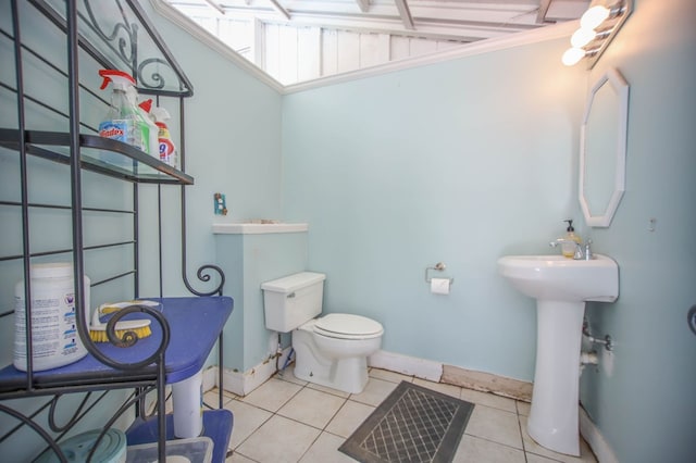 1514 Spanish Moss Dr, Lufkin, TX 75904 - bathroom with tile patterned floors, toilet, and baseboards
