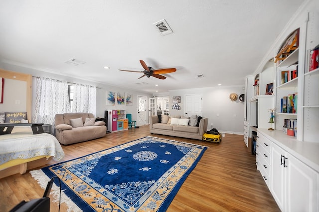 1514 Spanish Moss Dr, Lufkin, TX 75904 - living area featuring ornamental molding, wood finished floors, ceiling fan, baseboards, and recessed lighting