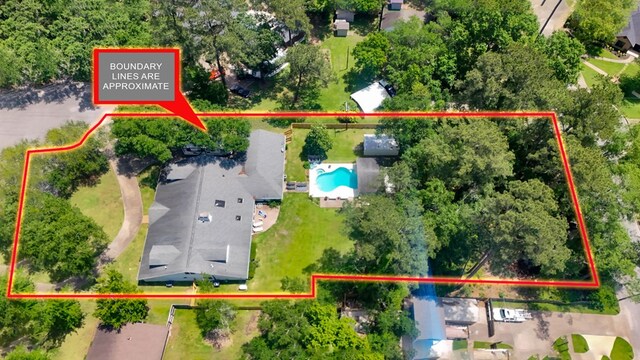 1514 Spanish Moss Dr, Lufkin, TX 75904 - aerial view of property and surrounding area with a pool and property boundaries highlighted