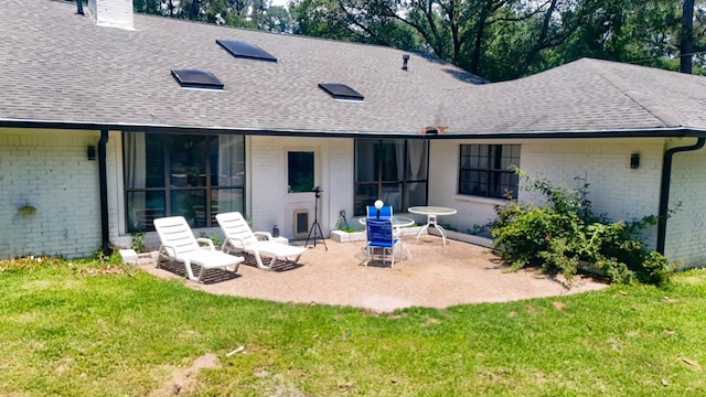 1514 Spanish Moss Dr, Lufkin, TX 75904 - rear view of property with roof with shingles, brick siding, and a yard