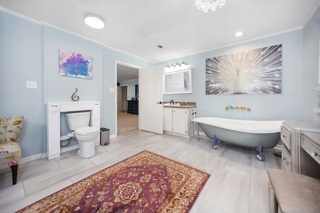 1514 Spanish Moss Dr, Lufkin, TX 75904 - bathroom with a soaking tub, ornamental molding, vanity, toilet, and baseboards