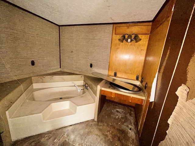 full bath featuring a bath and a textured ceiling