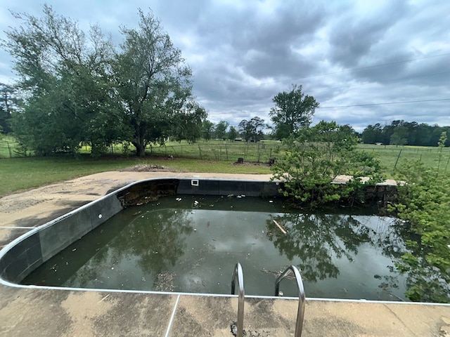 view of pool with fence