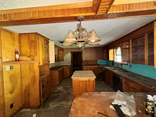 kitchen featuring a notable chandelier, a center island, decorative light fixtures, brown cabinets, and dishwasher