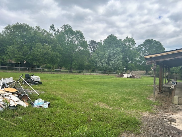 view of yard featuring a rural view and fence